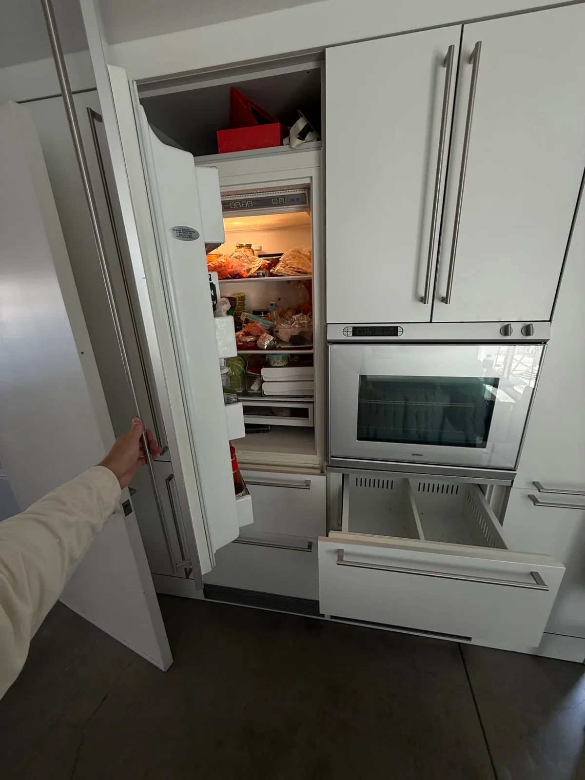 Built-in Sub-Zero refrigerator opened for service